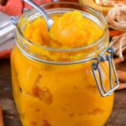 squared view of pumpkin puree in a glass jar.