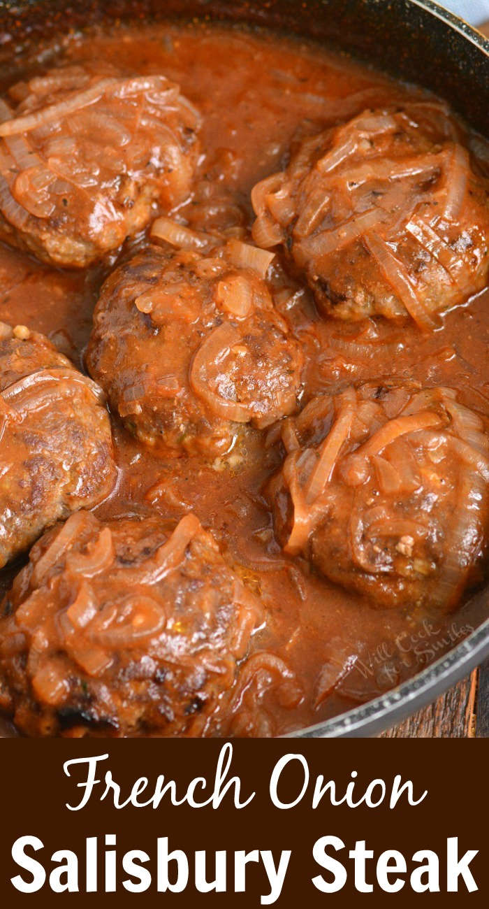 french onion Salisbury steak in a pan with gravy 