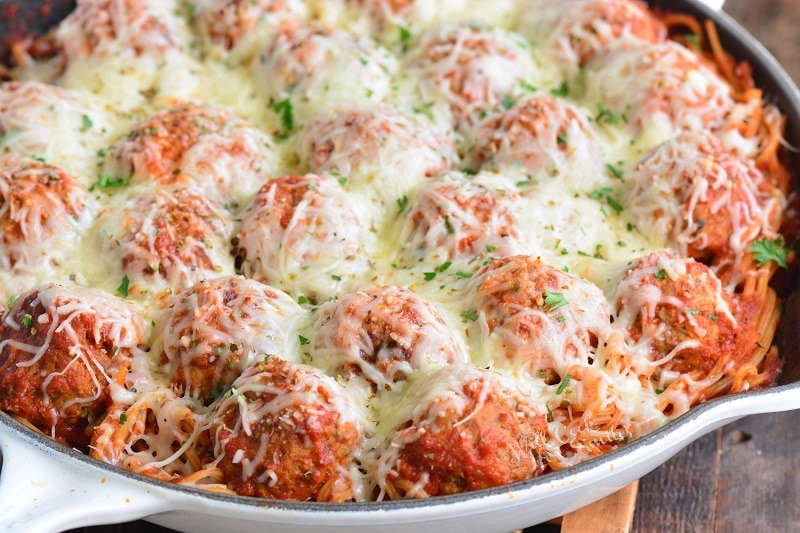 baked spaghetti and meatballs in a pan 