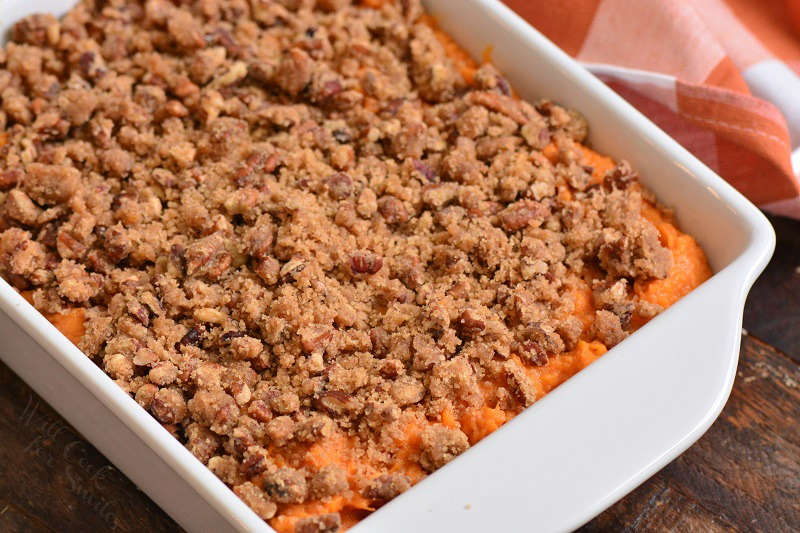 closeup sweet potato casserole in white dish.