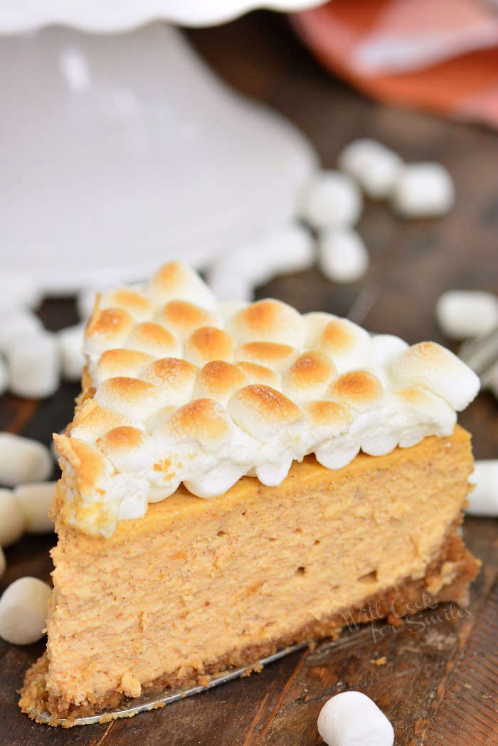 sweet potato cheesecake slice on a wood cutting board 