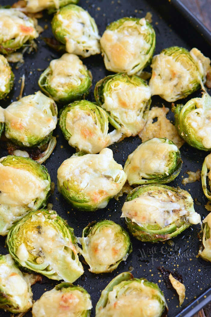 Roasted brussels sprouts with parmesan cheese on a baking sheet 