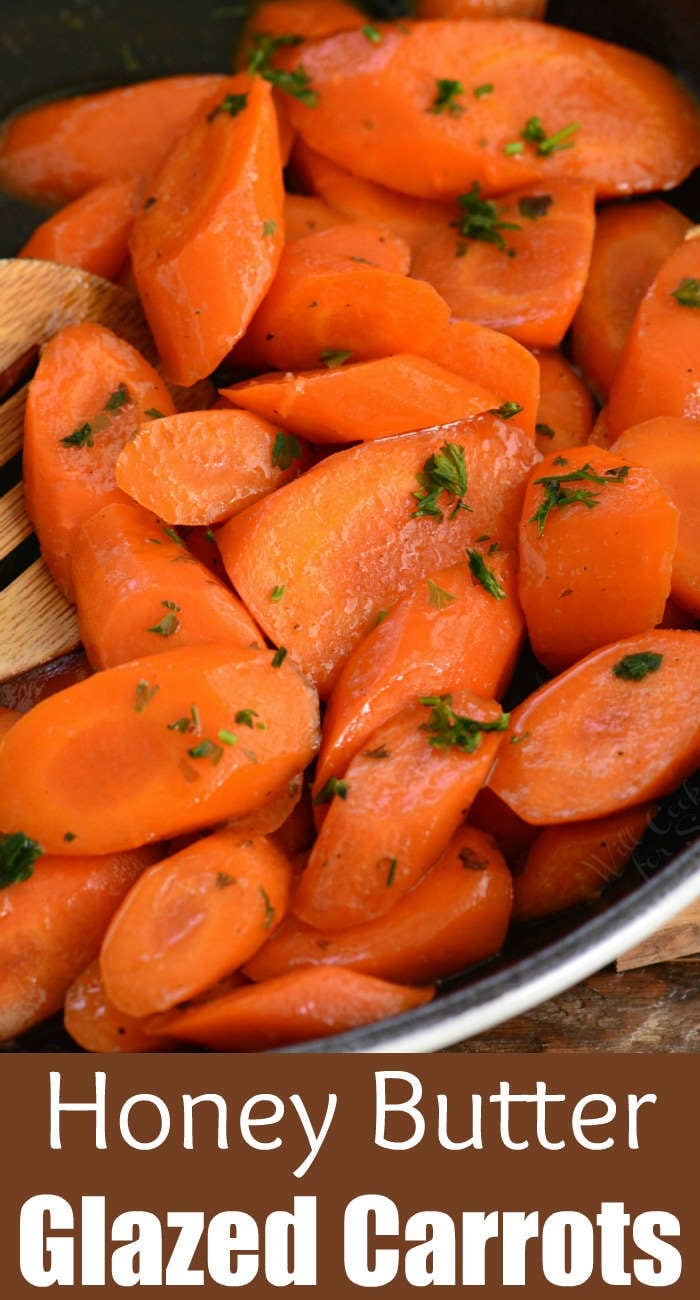 glazed carrots in honey butter in a cast iron skillet 