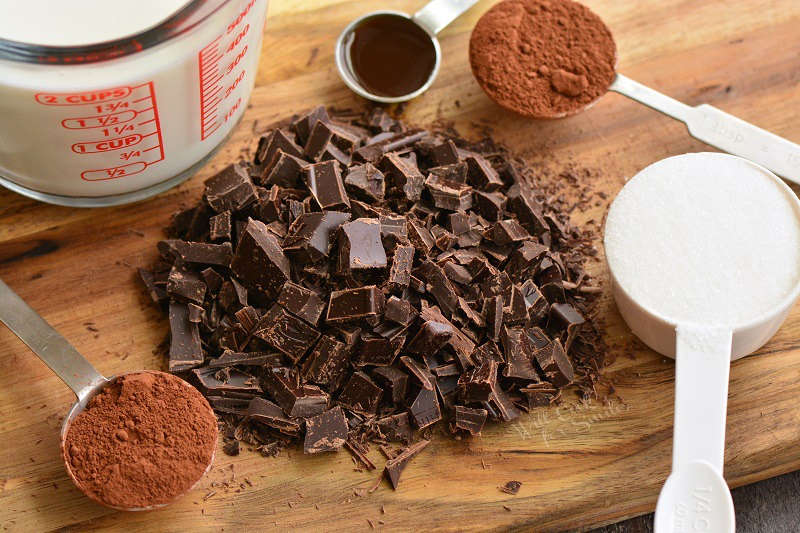 ingredients for hot chocolate on a wood cutting board 