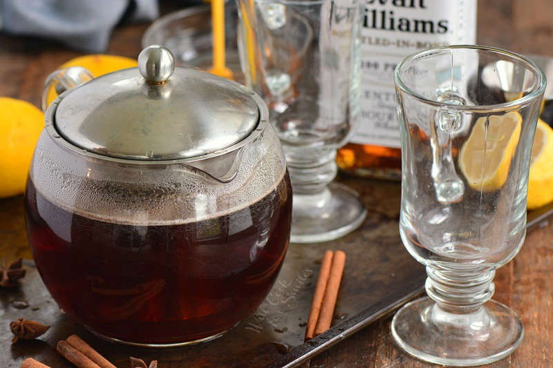 tea steeping in a glass tea pot and glasses.