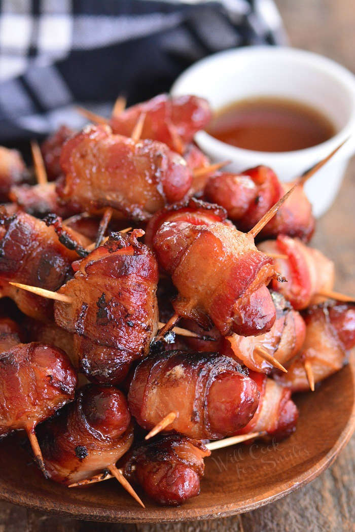 bacon wrapped little smokies horizontal in a wood bowl 