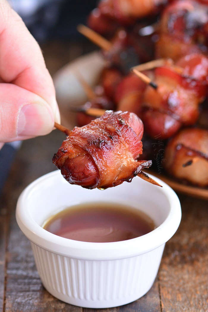dipping little smokies into maple syrup
