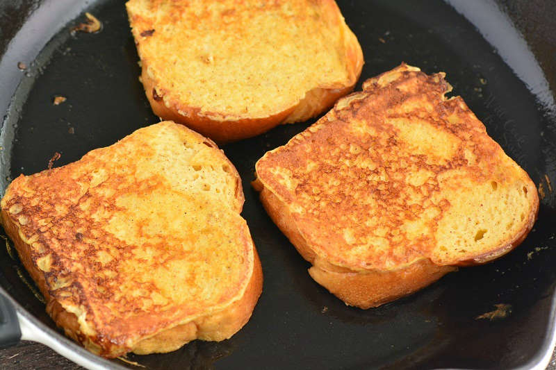 eggnog french toast cooking in the pan