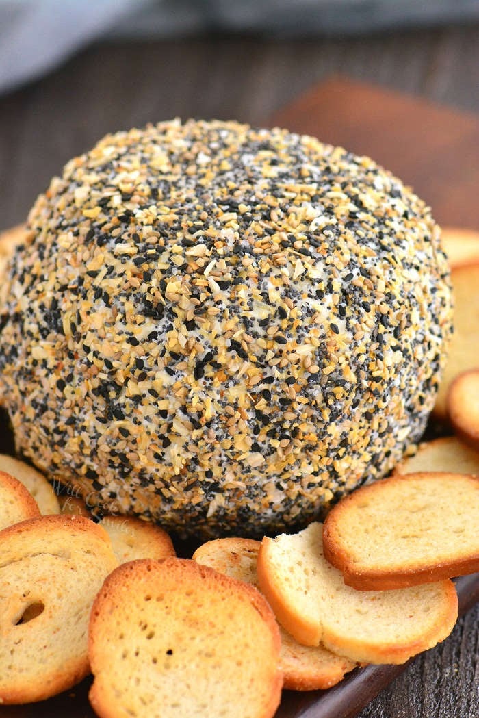 cheese ball on a board with bagel chips