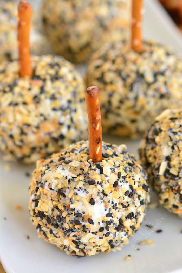 mini cheese balls with pretzels on a serving plate 