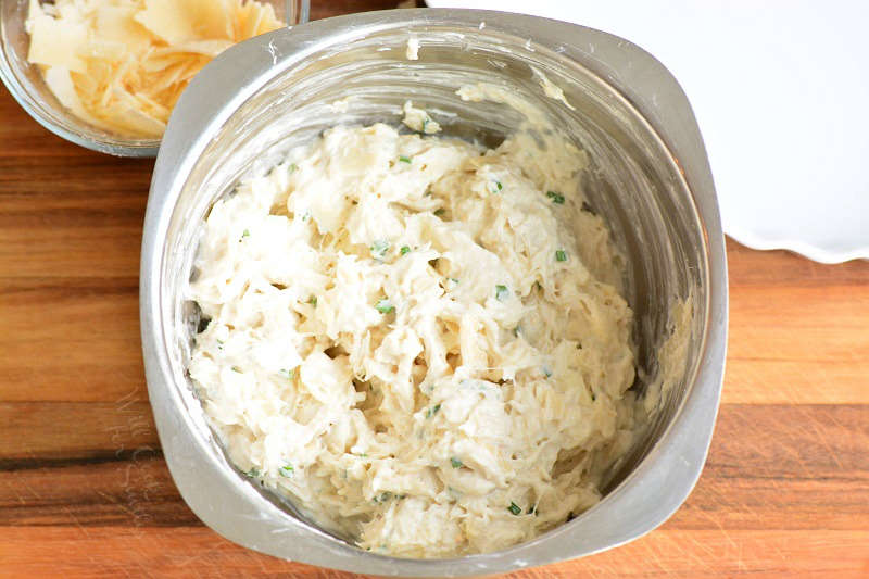 mixed ingredients for crab dip in metal bowl.