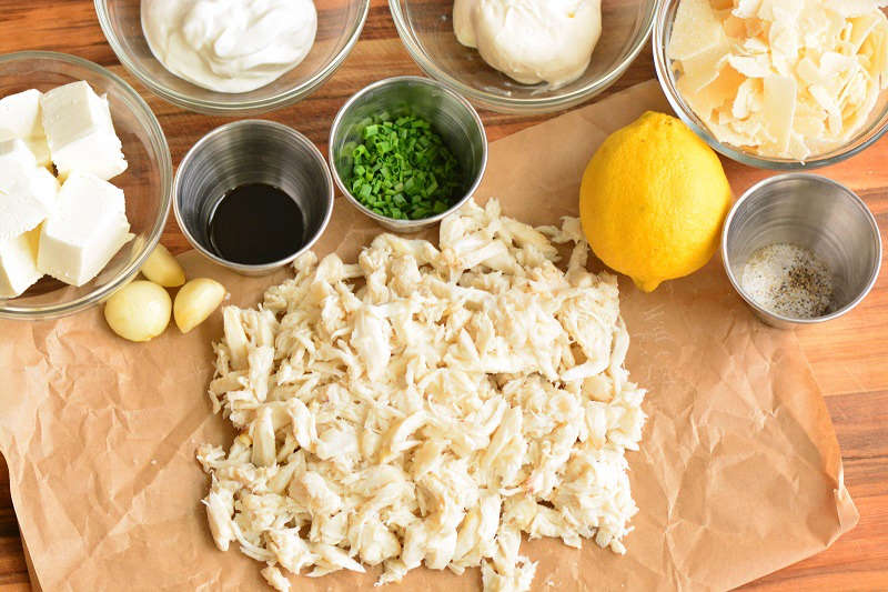 ingredients for the crab dip on the board.