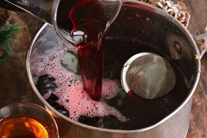 pouring wine into the pot
