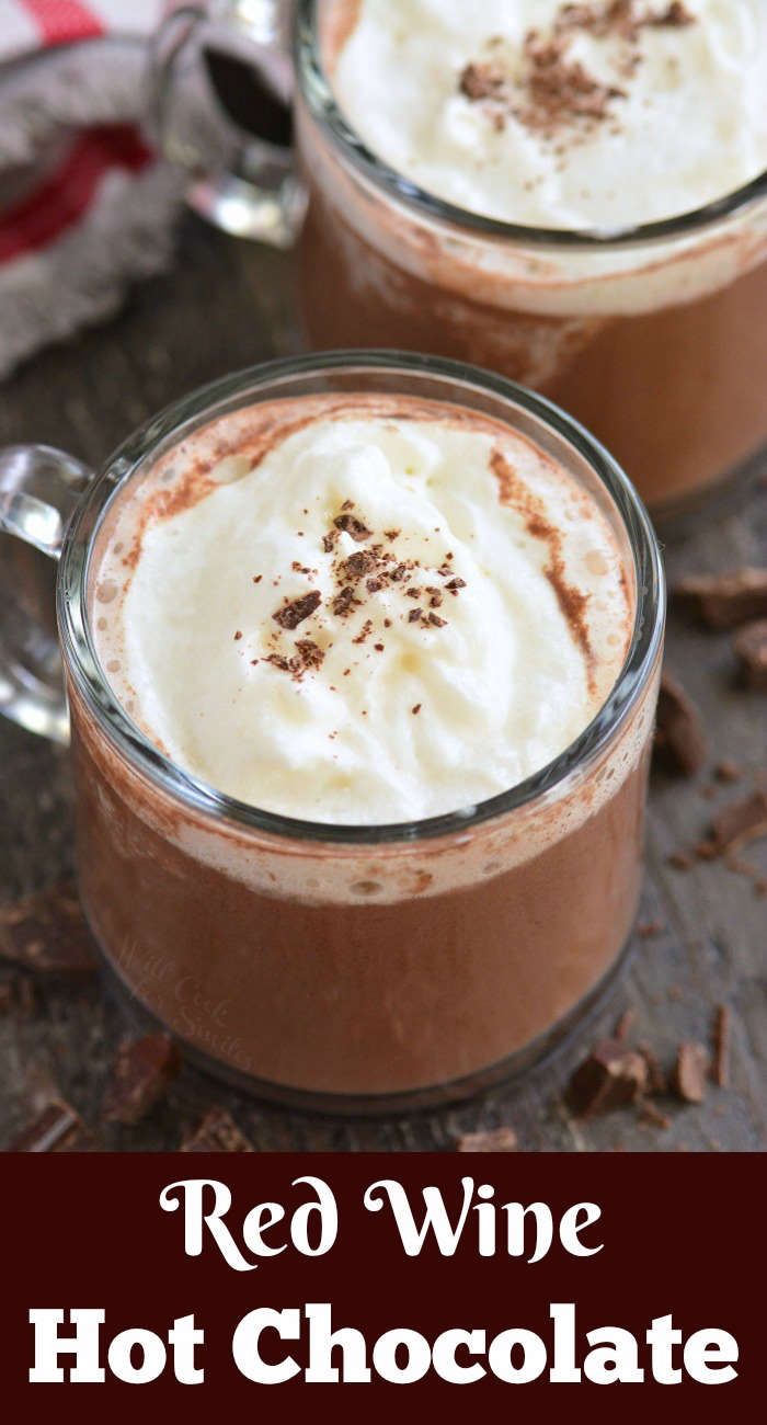 red wine hot chocolate in glass mugs on a wood cutting board 