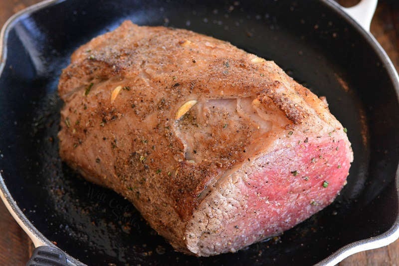 searing the meat first in a cast iron pan