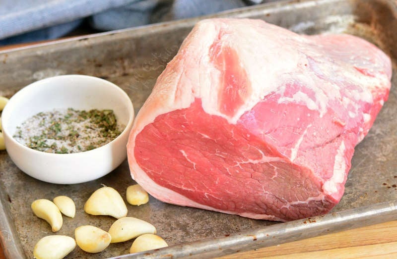ingredients for roast beef on a baking sheet 