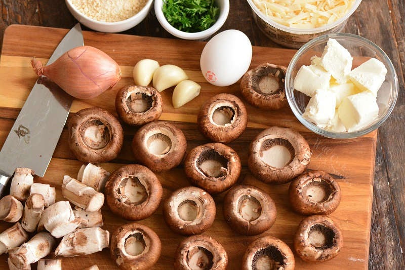 ingredients for stuffed mushrooms on the cutting board