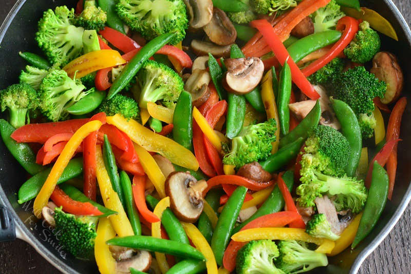 stir fry vegetables in a pan 