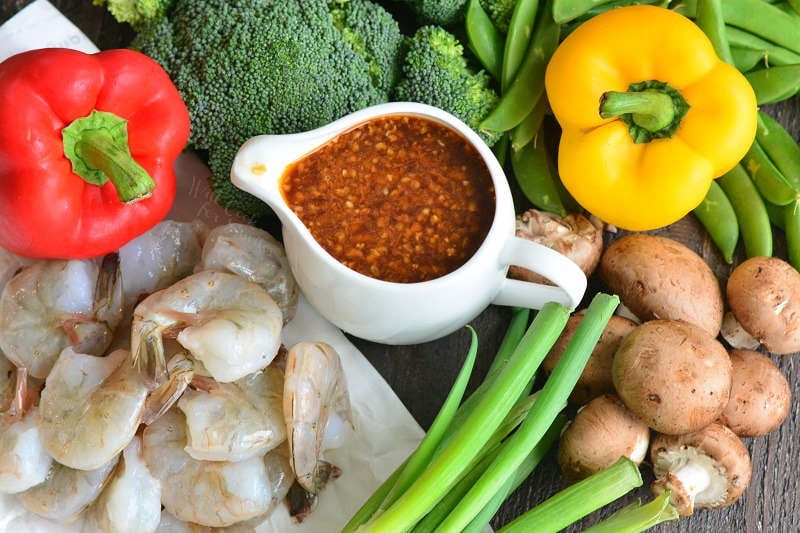 ingredients to make shrimp stir fry gathered together.