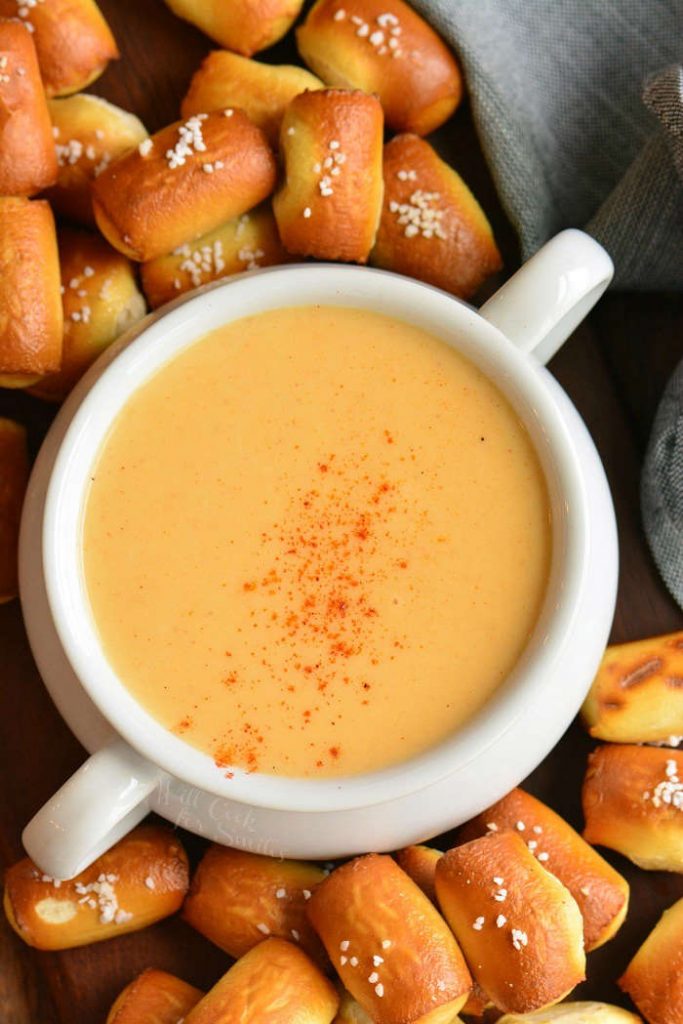 top view of beer cheese dip surrounded by pretzel bites. 