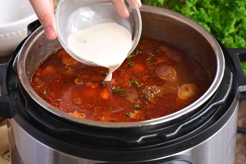 adding cornstarch mixture to the stew