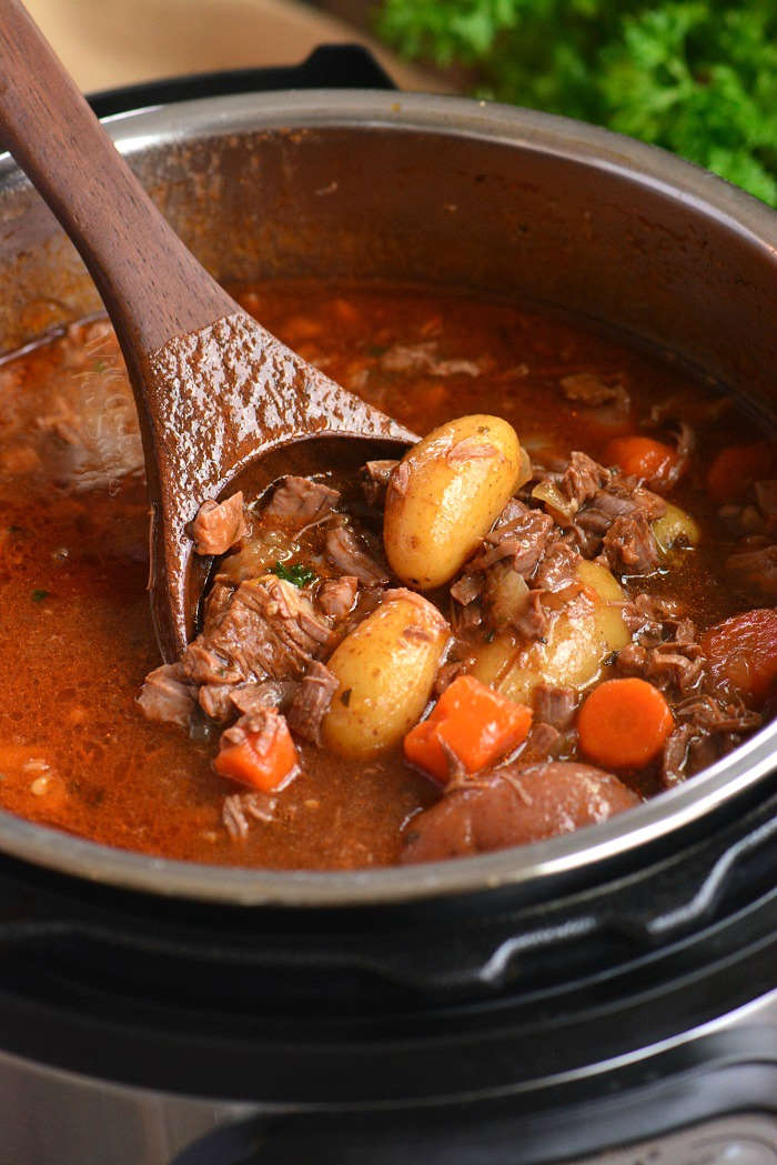 cooping out beef stew from the pot