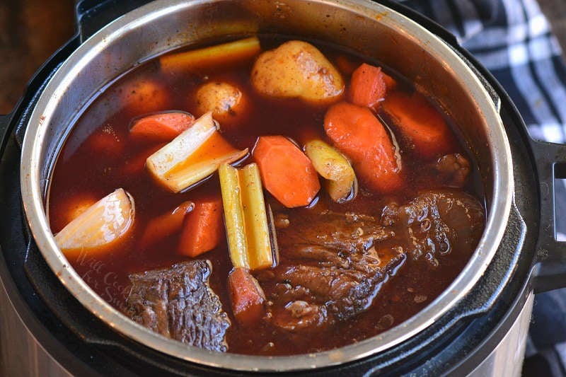 add vegetables to the cooked pot roast in the instant pot 