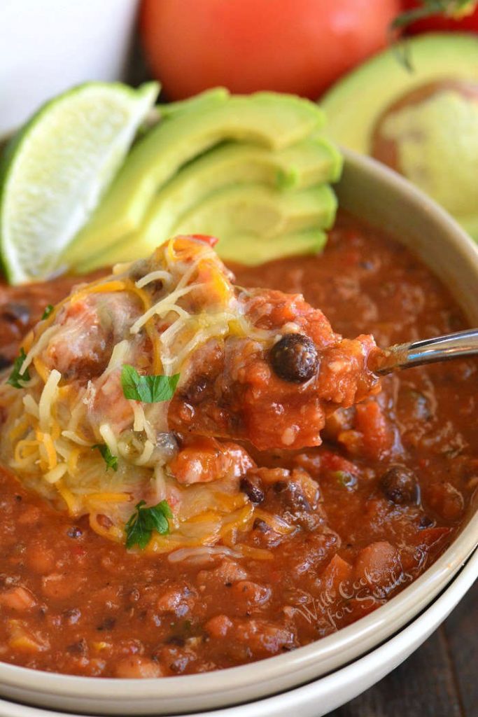closeup of scooping some vegetarian chili from the bowl. 