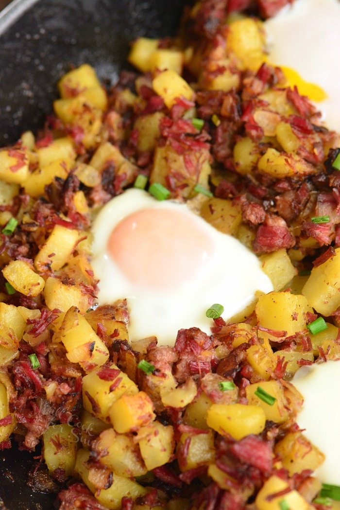 closeup of corned beef hash cooked with egg.