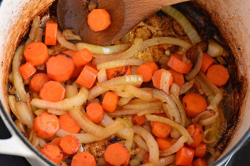 onions and carrots searing in the pot