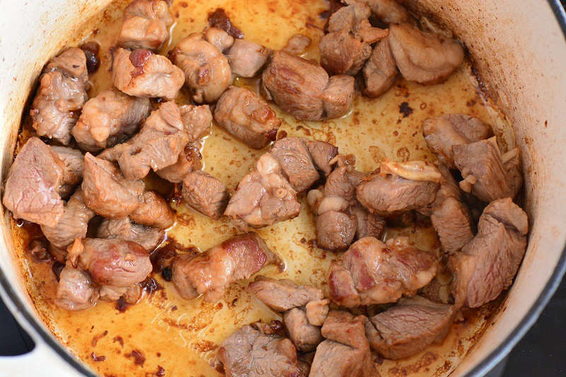 lamb searing in a pot