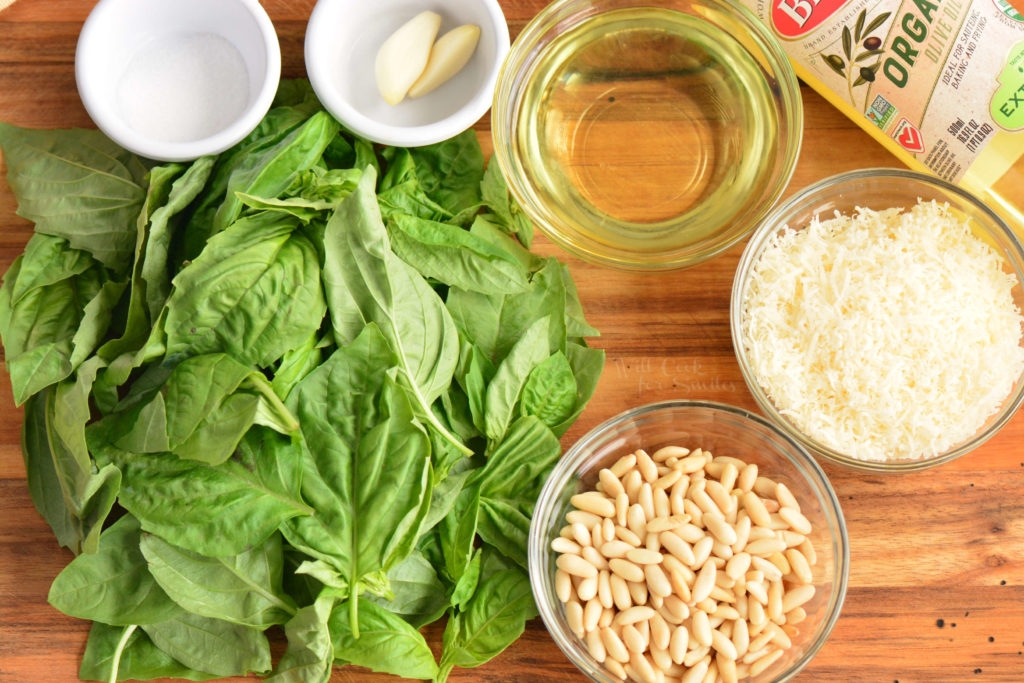 ingredients for basil pesto on the cutting board.