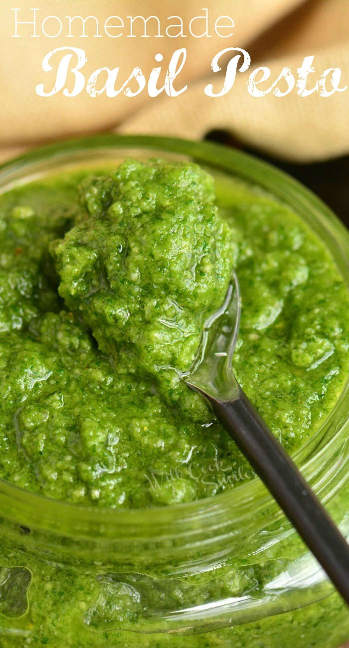 closeup of spooning out some pesto from a jar and title.