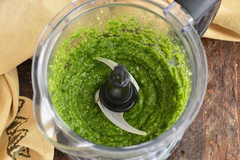 green basil pesto in the blender.