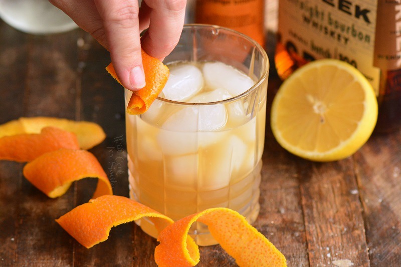 rub the rim of the glass with orange twist