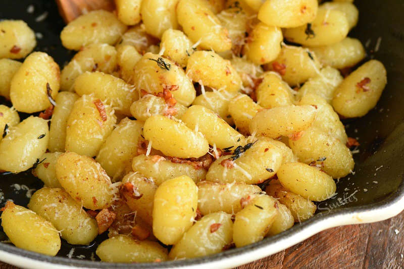 horizontal view of cooked gnocchi in the pan