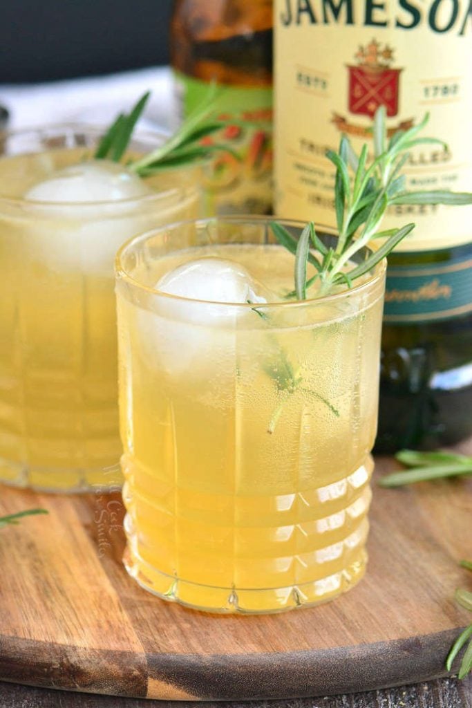 two light yellow Irish cocktail next to Jameson.