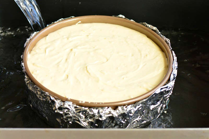 pouring water into the roasting pan 