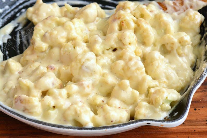 cauliflower mixed with cheese sauce in the pan