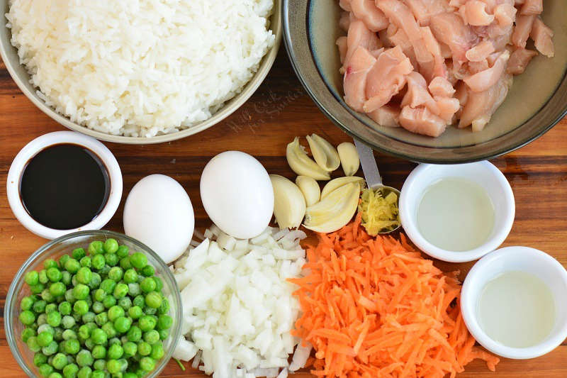 ingredients for chicken fried rice on the cutting board