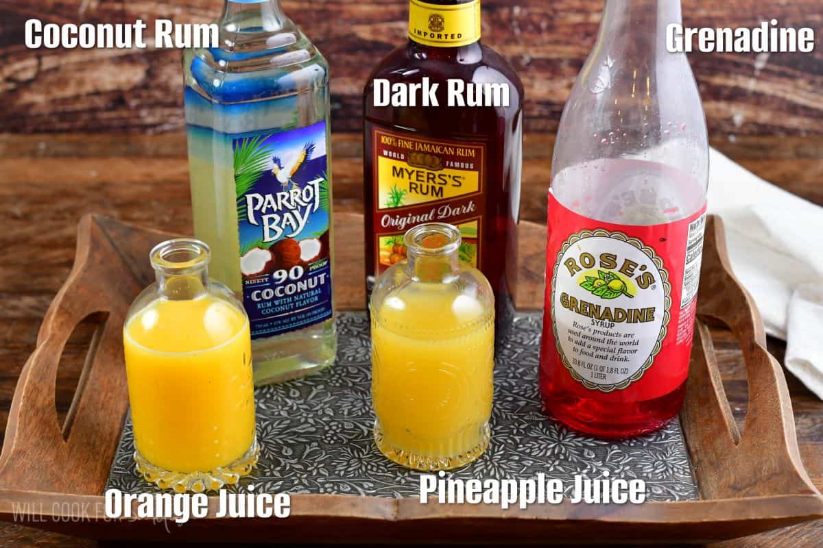 labeled ingredients to make Bahama mama recipe on a serving tray. 