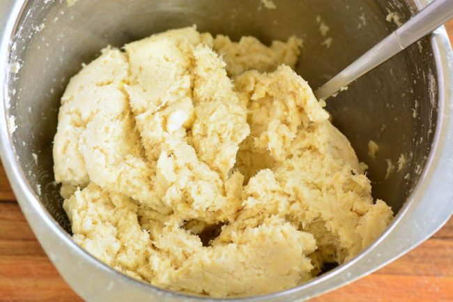 mixing cauliflower dough in a bowl