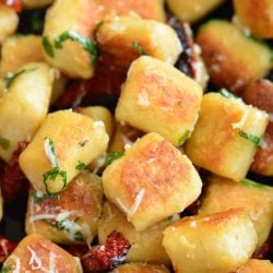 crispy cauliflower gnocchi cooked with sun died tomatoes, basil, and Parmesan cheese