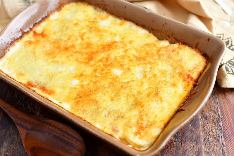 overhead photo: potatoes au gratin in casserole dish