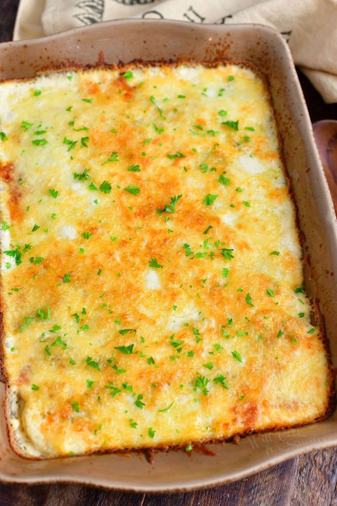 overhead photo: cheesy potato side dish baked in a casserole dish
