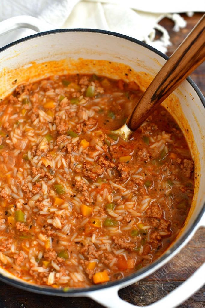 overhead photo: stuffed peppers soup cooking in large white pot