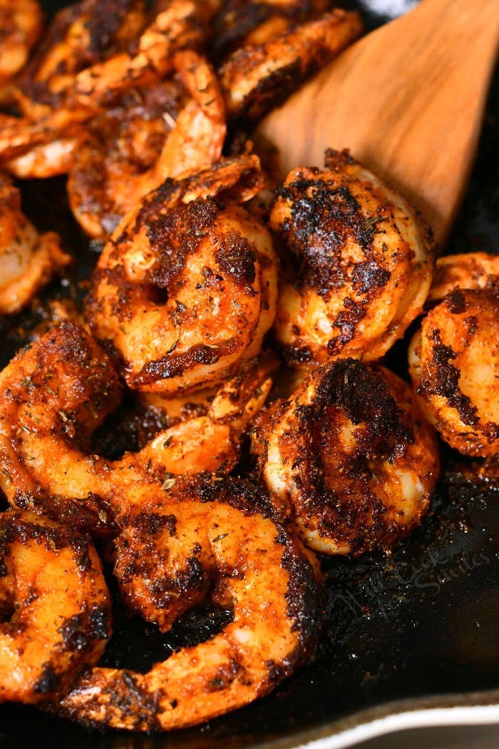 close up photo: tail-on shrimp with blackening spices
