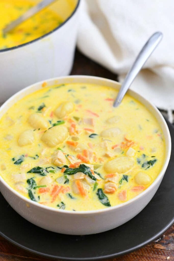 bowl of homemade Olive Garden chicken soup with spoon in bowl