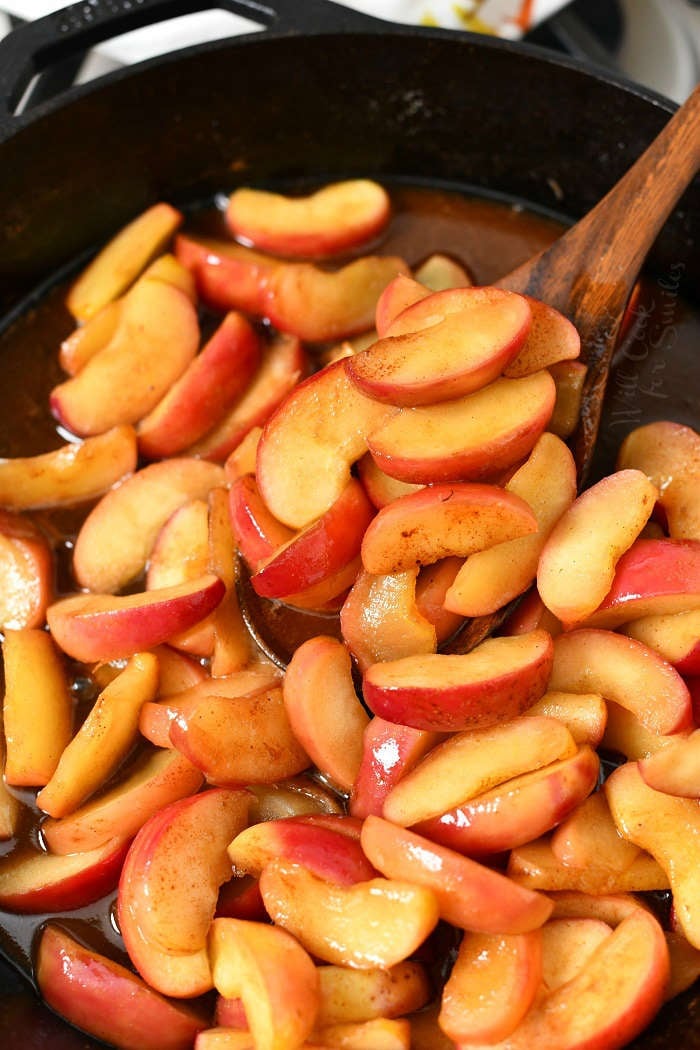 pan frying apple slices in cast iron skillet