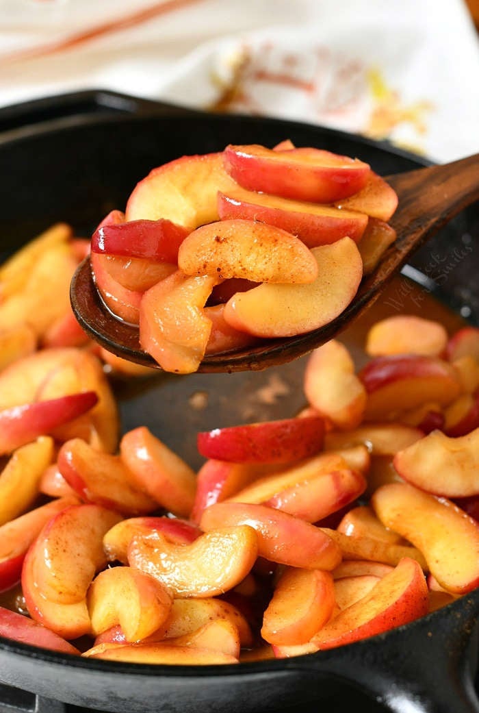 close up of red pan fried apples